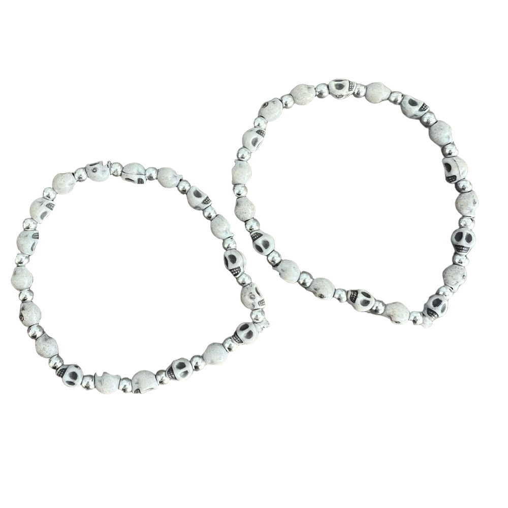 Skull face and silver tone bead stretch bracelet set